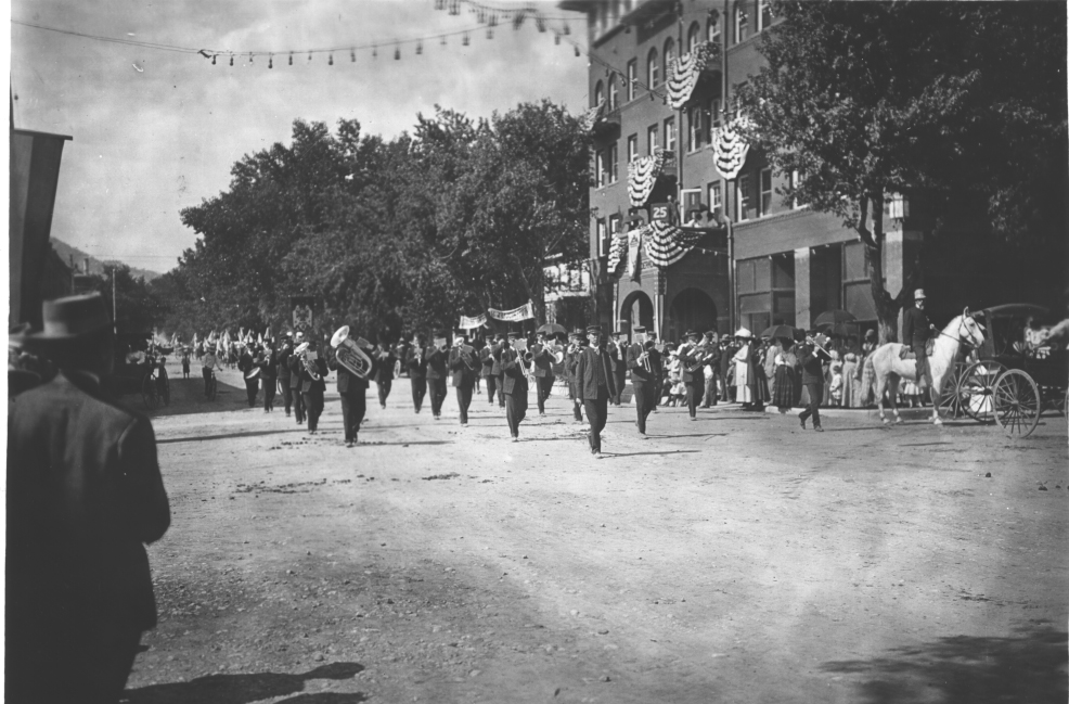a group of people marching in a street