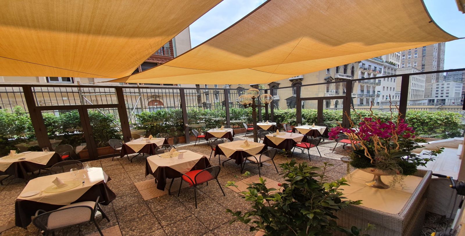 a patio with tables and chairs