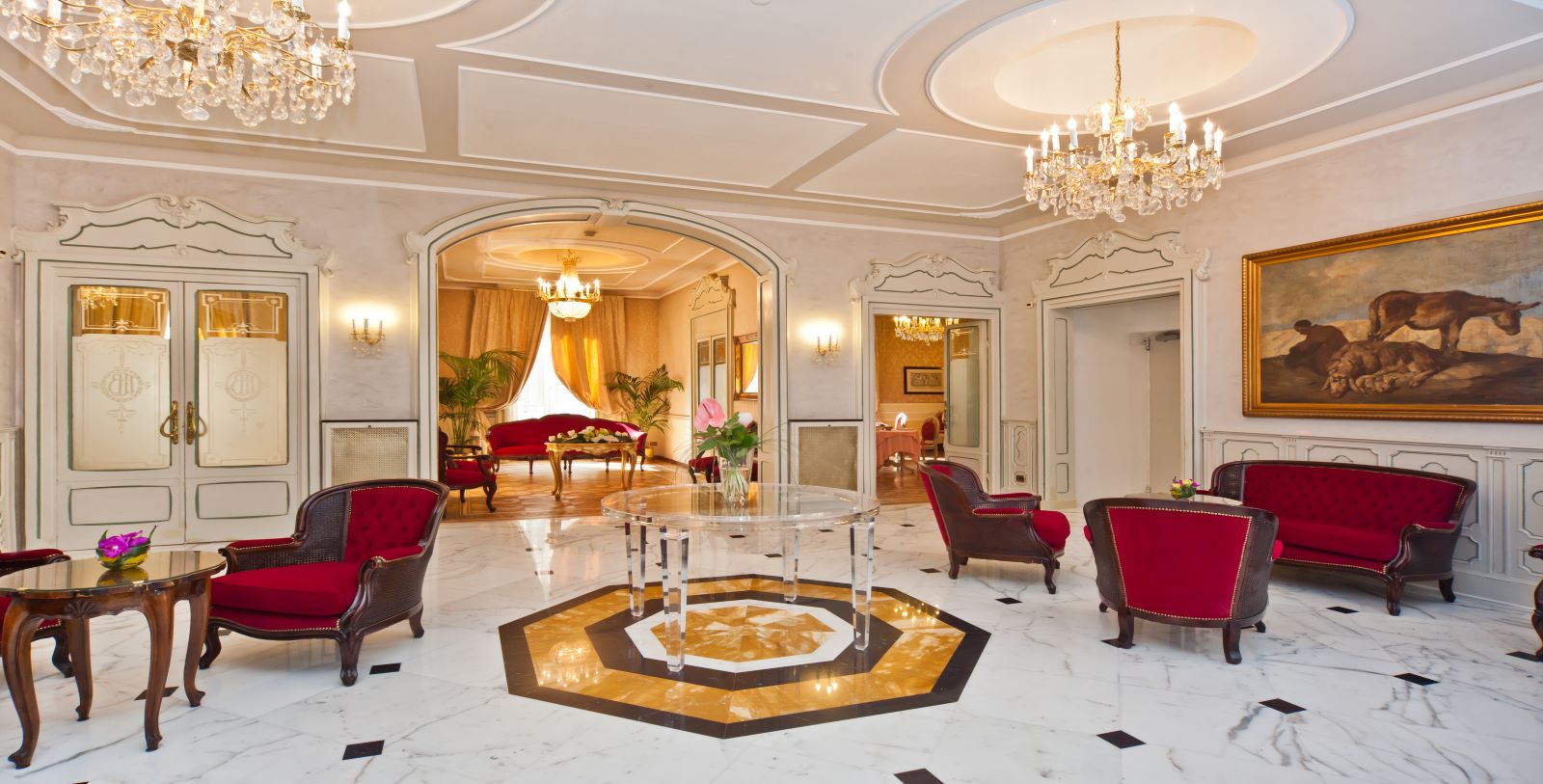 a room with a glass table and chairs