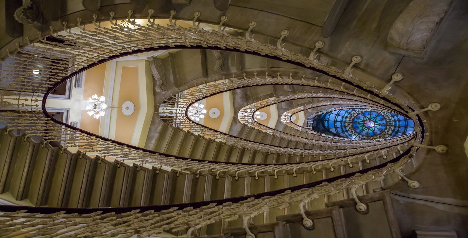 a spiral staircase with a glass ceiling