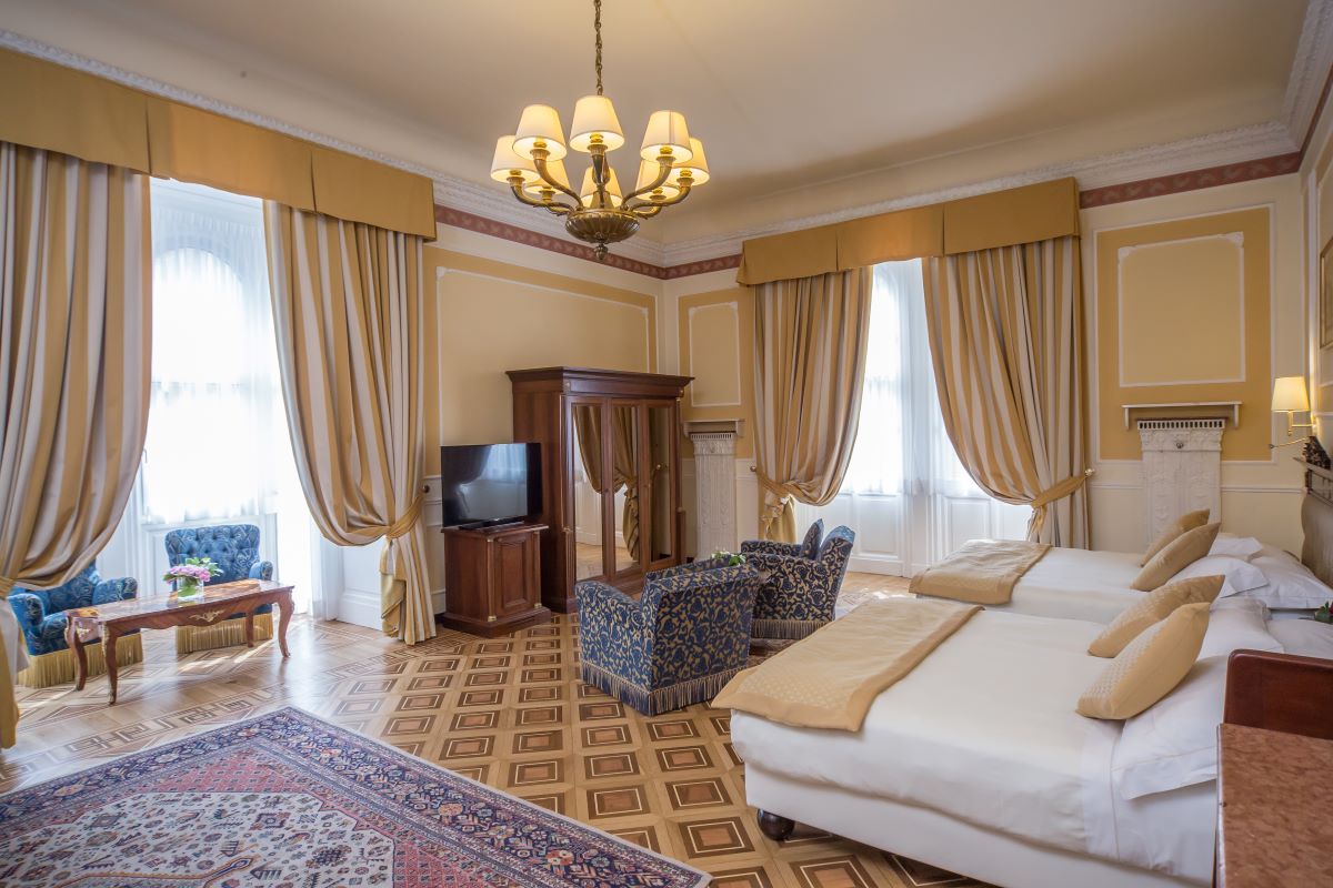 a room with a bed and a television