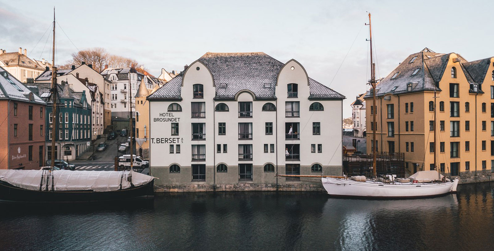 a building next to a body of water