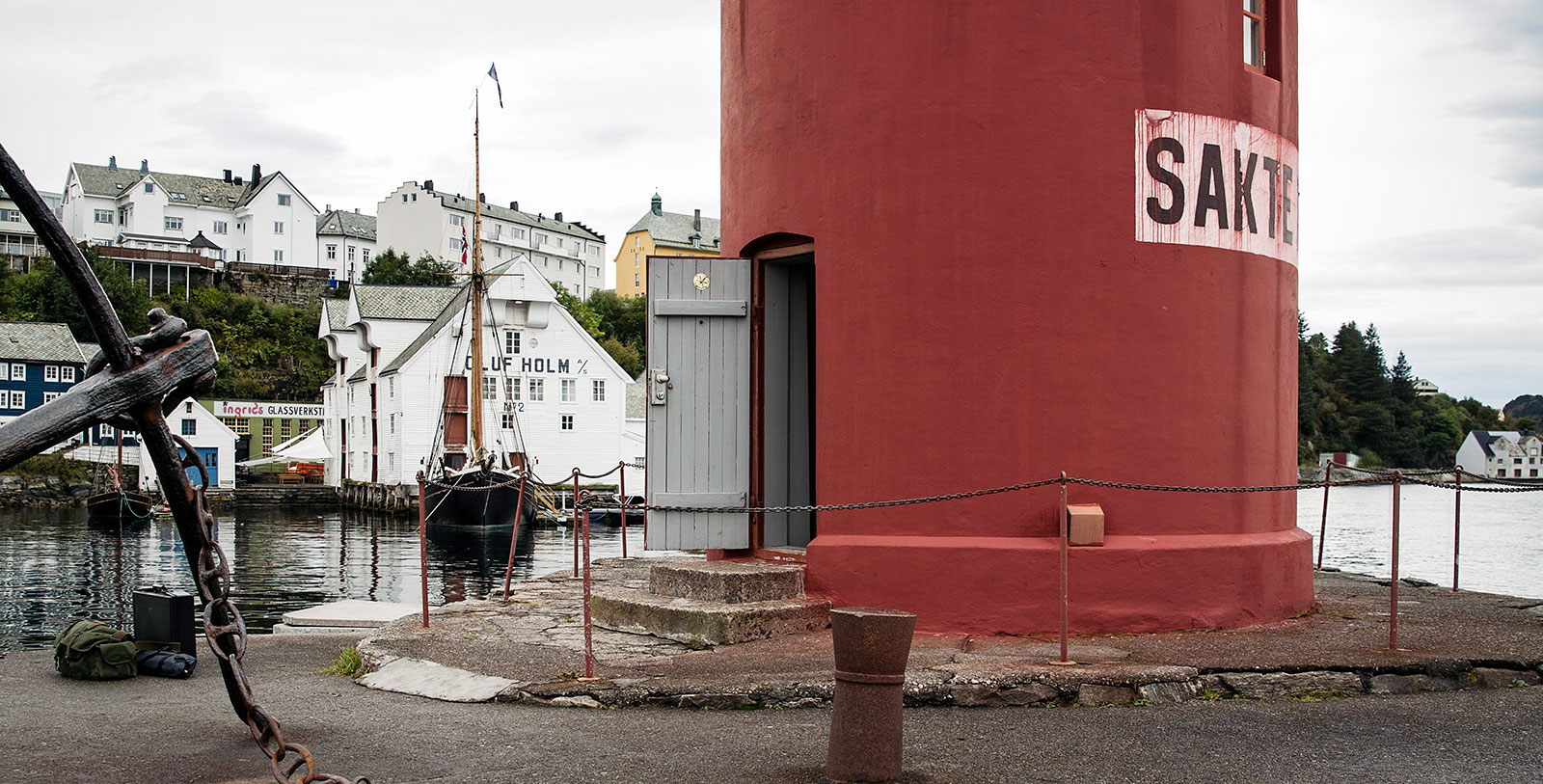a red building with a sign on the side