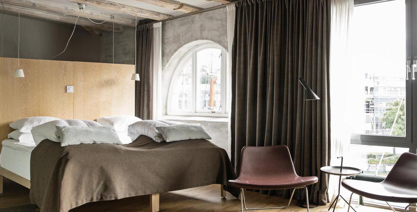 a room with a bed and a chair