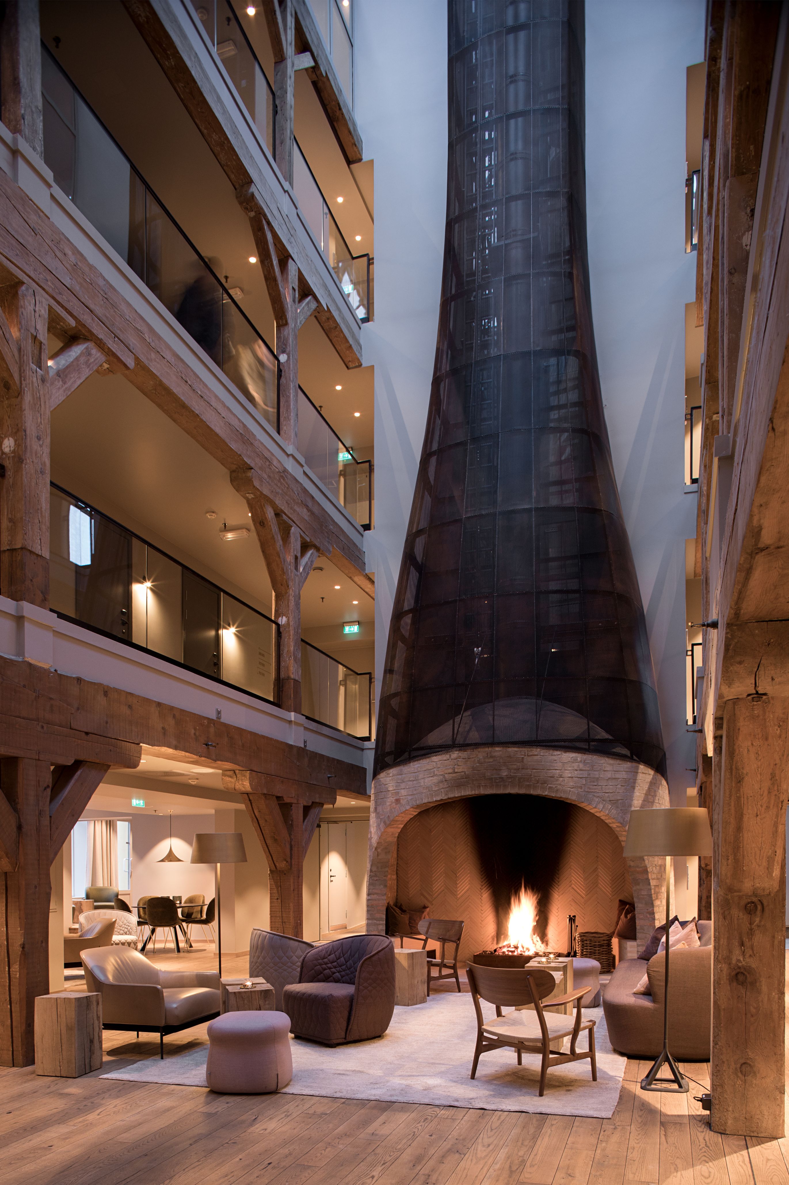 a room with a fireplace and a large stone tower