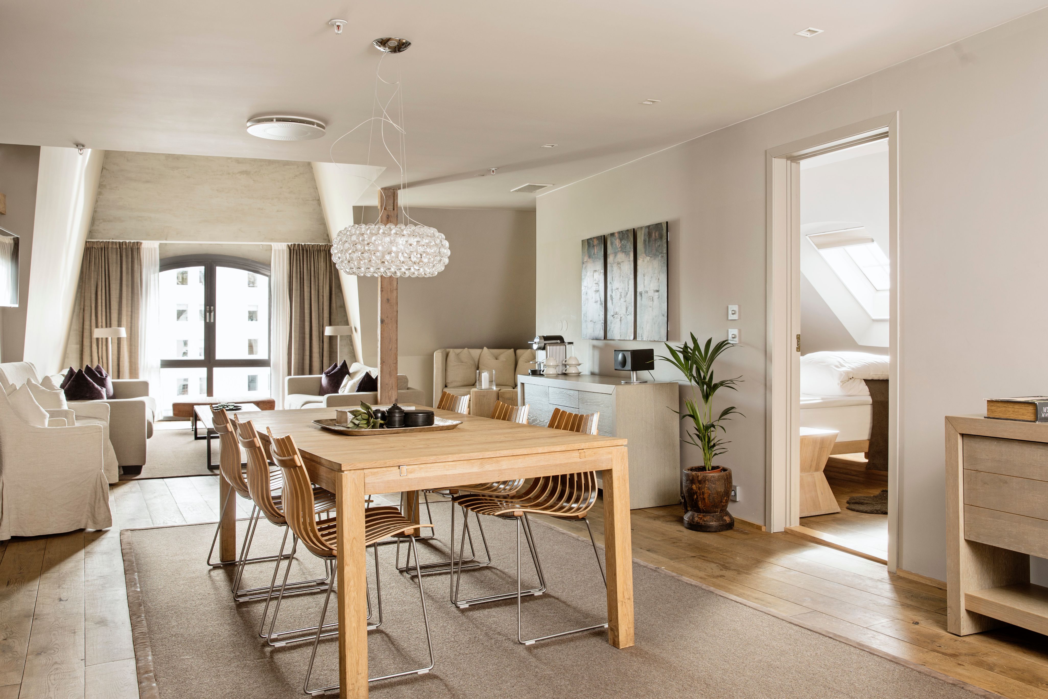 a dining table and chairs in a room