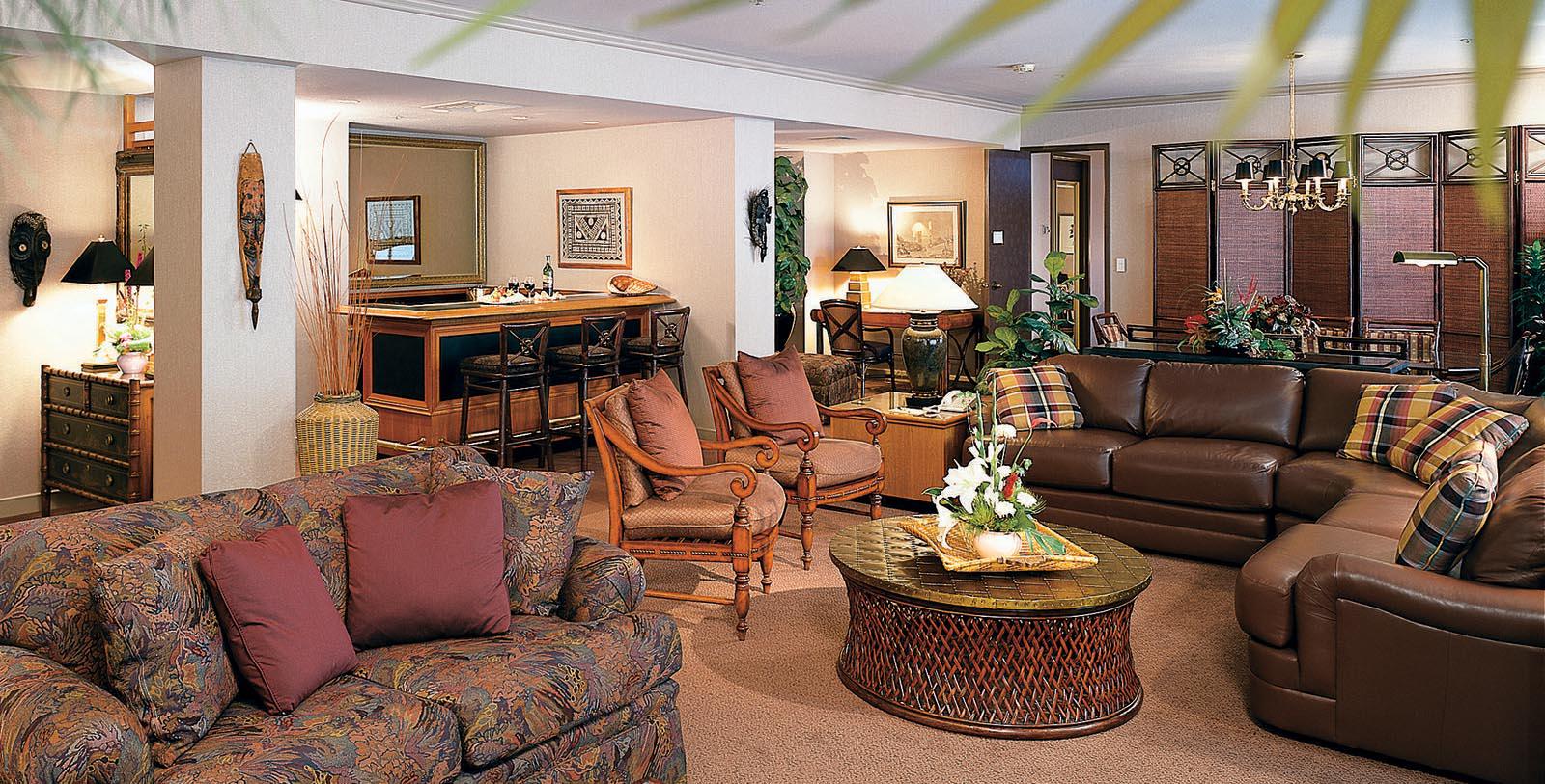 a living room with couches and chairs