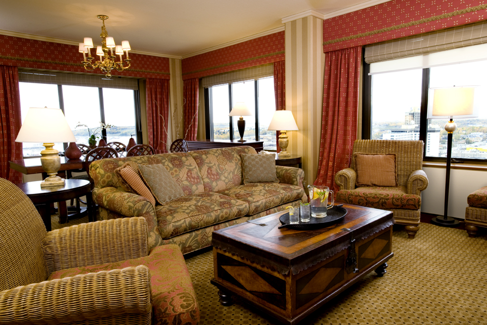 a living room with a couch and chairs