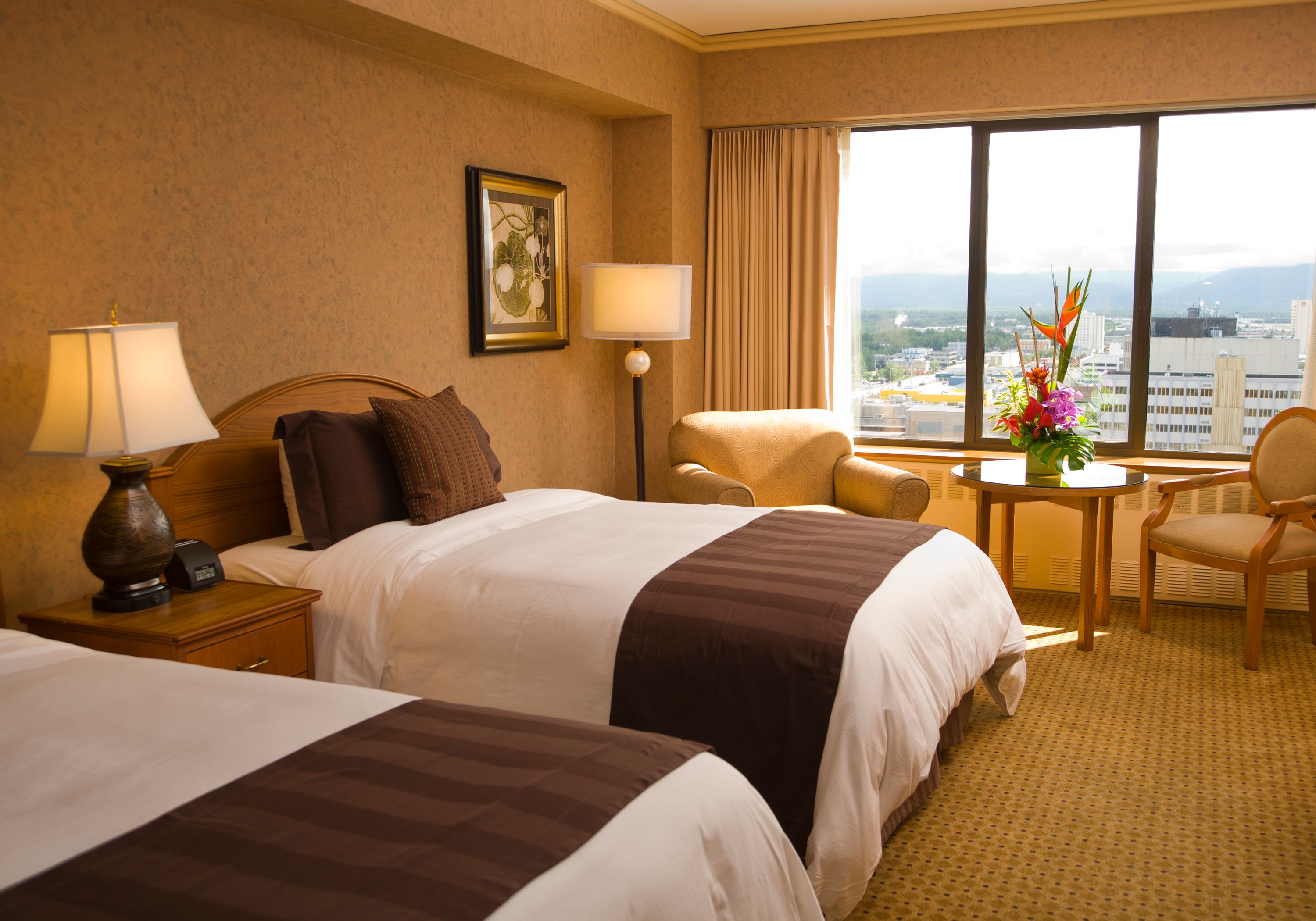 a hotel room with two beds