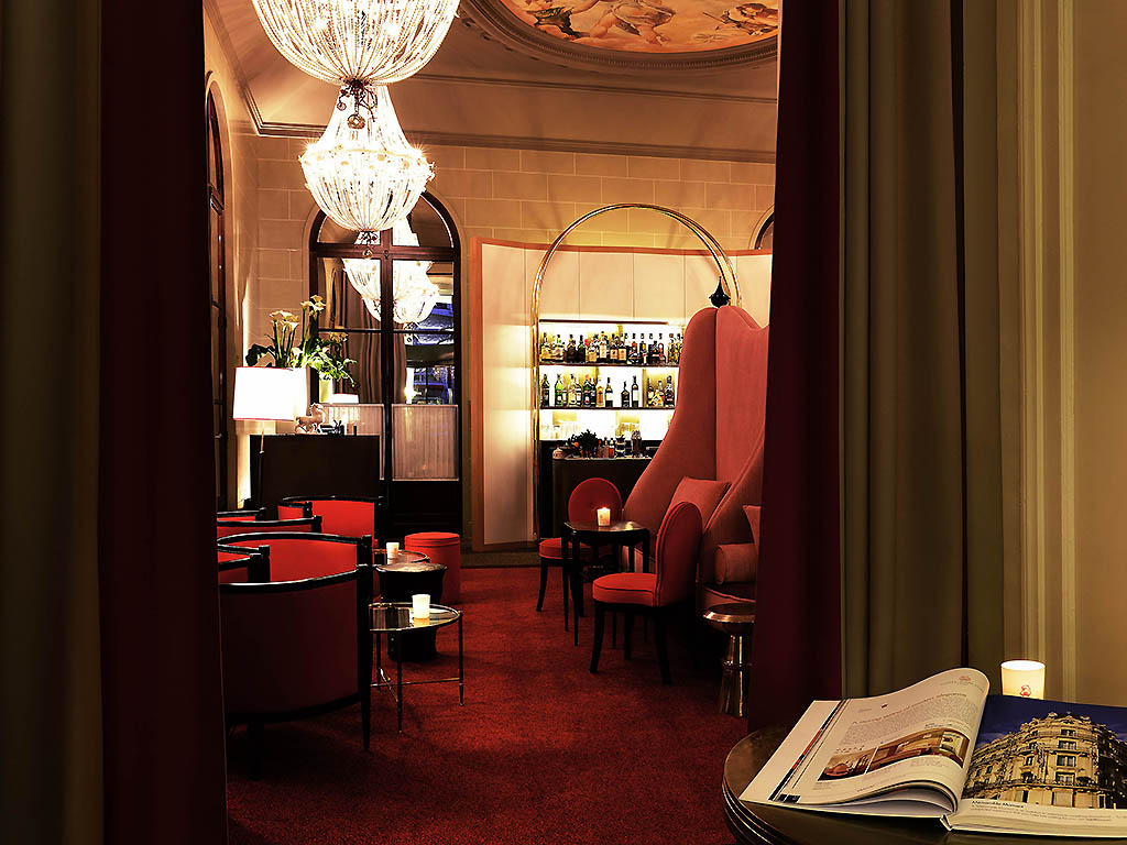 a room with a table and chairs and a book