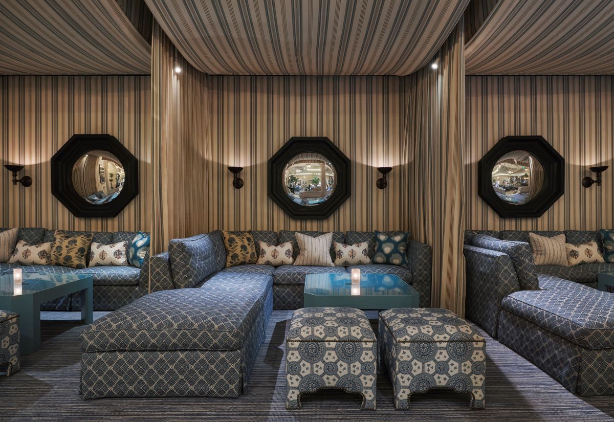 a room with striped walls and a couch