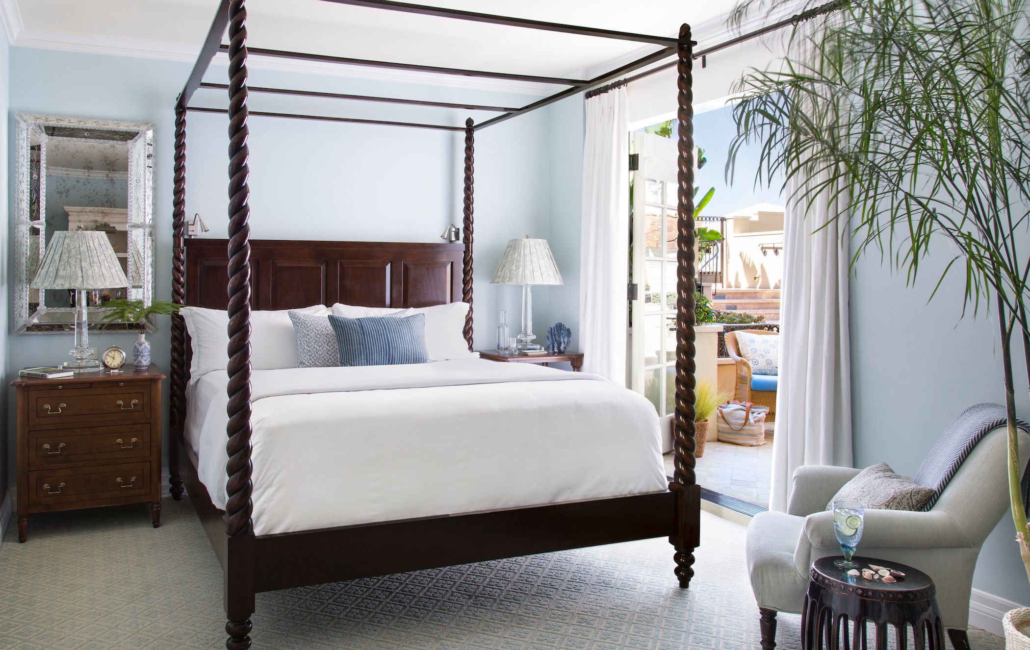 a bed with a four poster bed