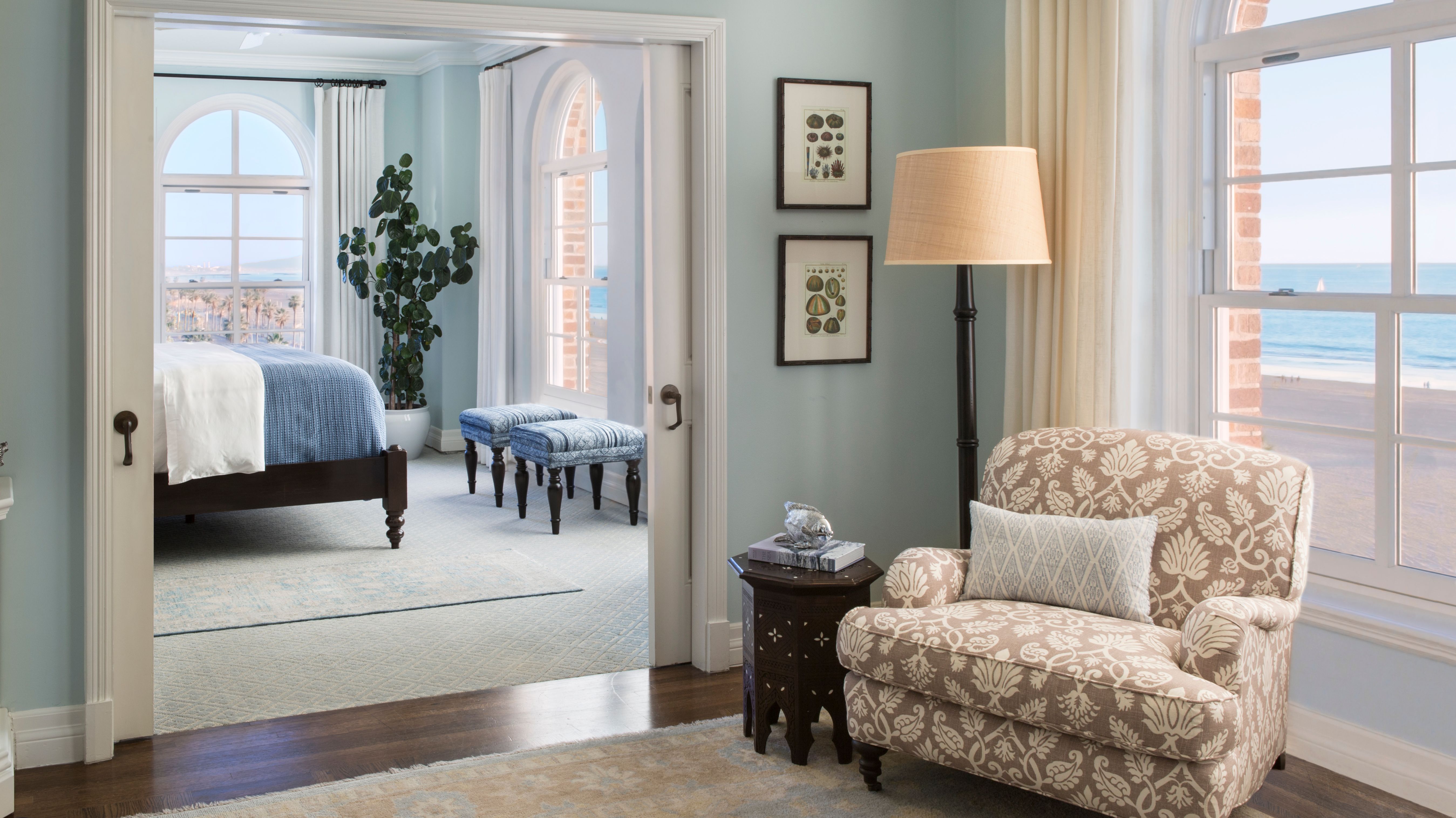 a living room with a couch and a lamp