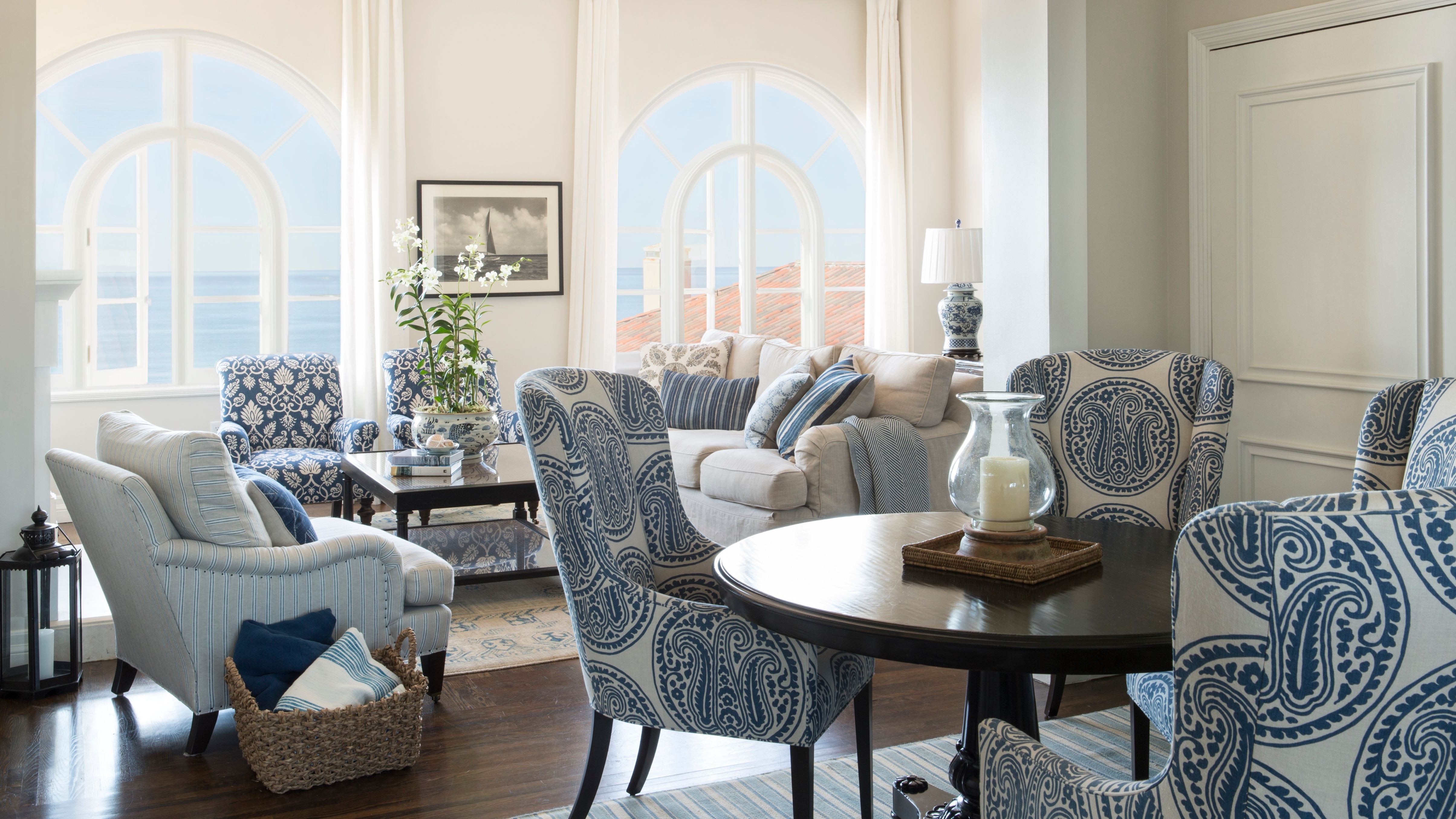 a living room with a table and chairs
