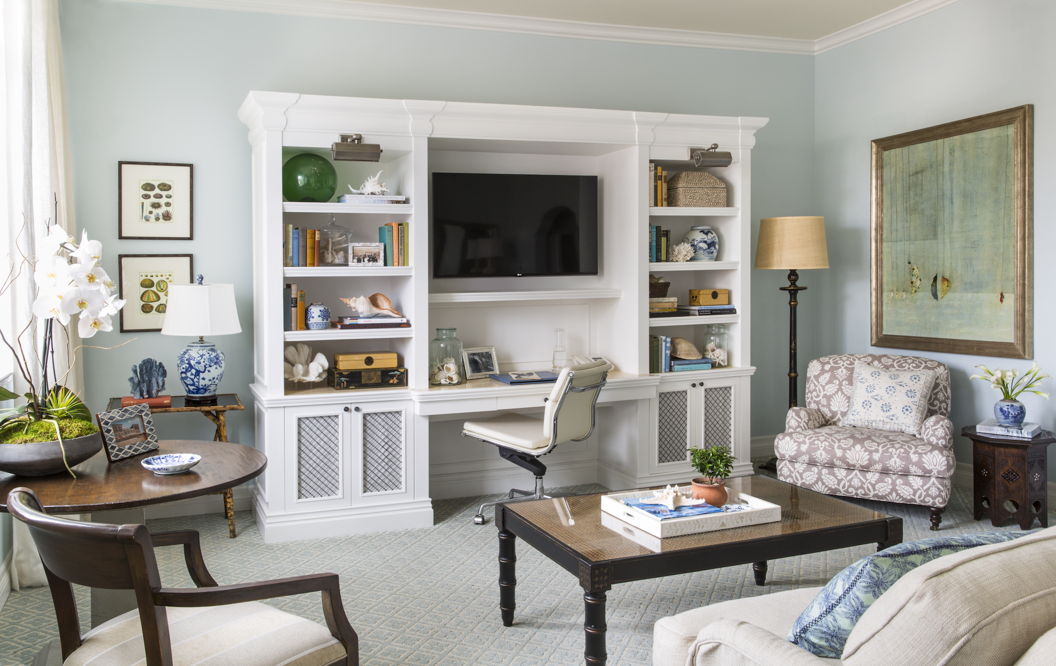 a living room with a tv and a white wall