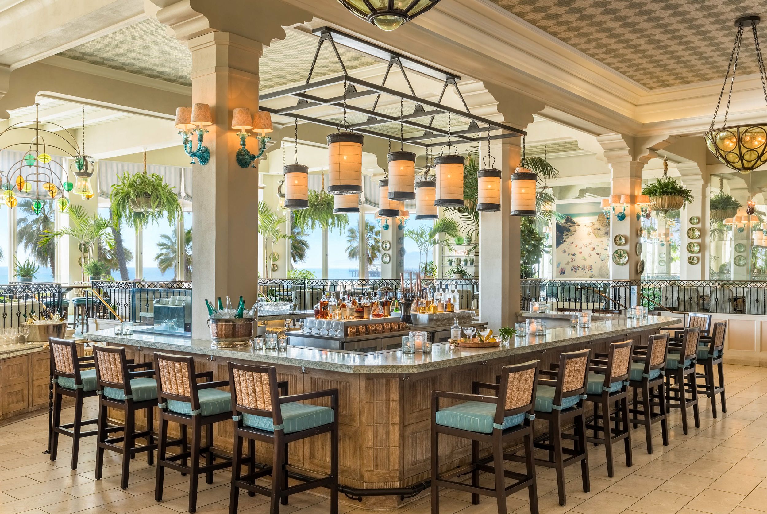 a bar with chairs and lights