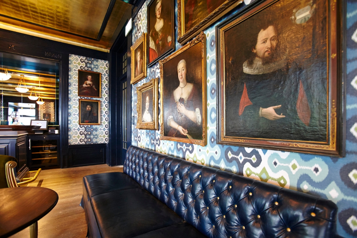 a long couch with a long black bench and a long black bench with a long black bench and a long black bench with a long black bench with a long black bench with a long black bench with