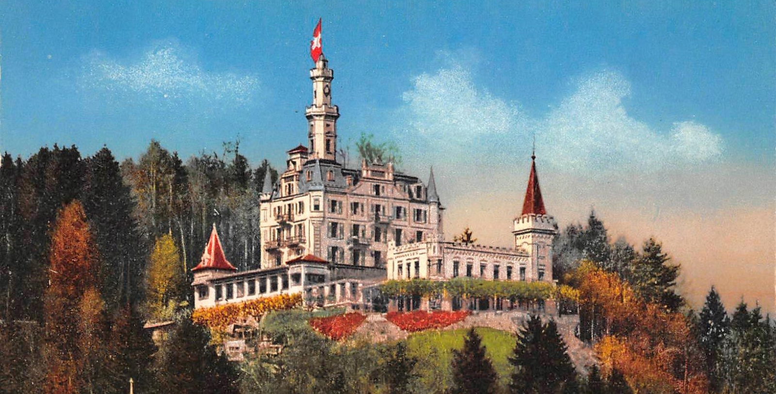 a large white building with a flag on top