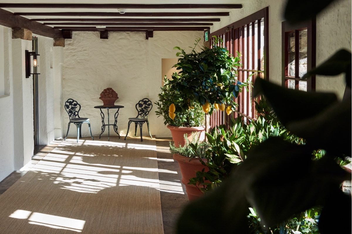 a patio with chairs and a table