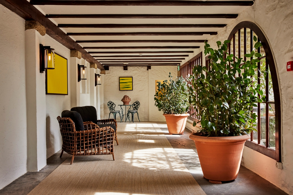 a room with a patio and a chair and a table