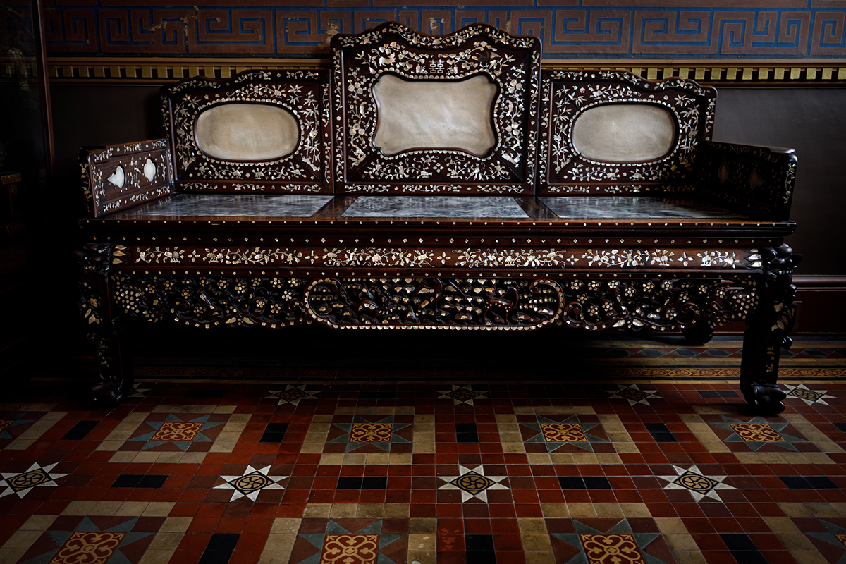 a ornate wood and stone bench