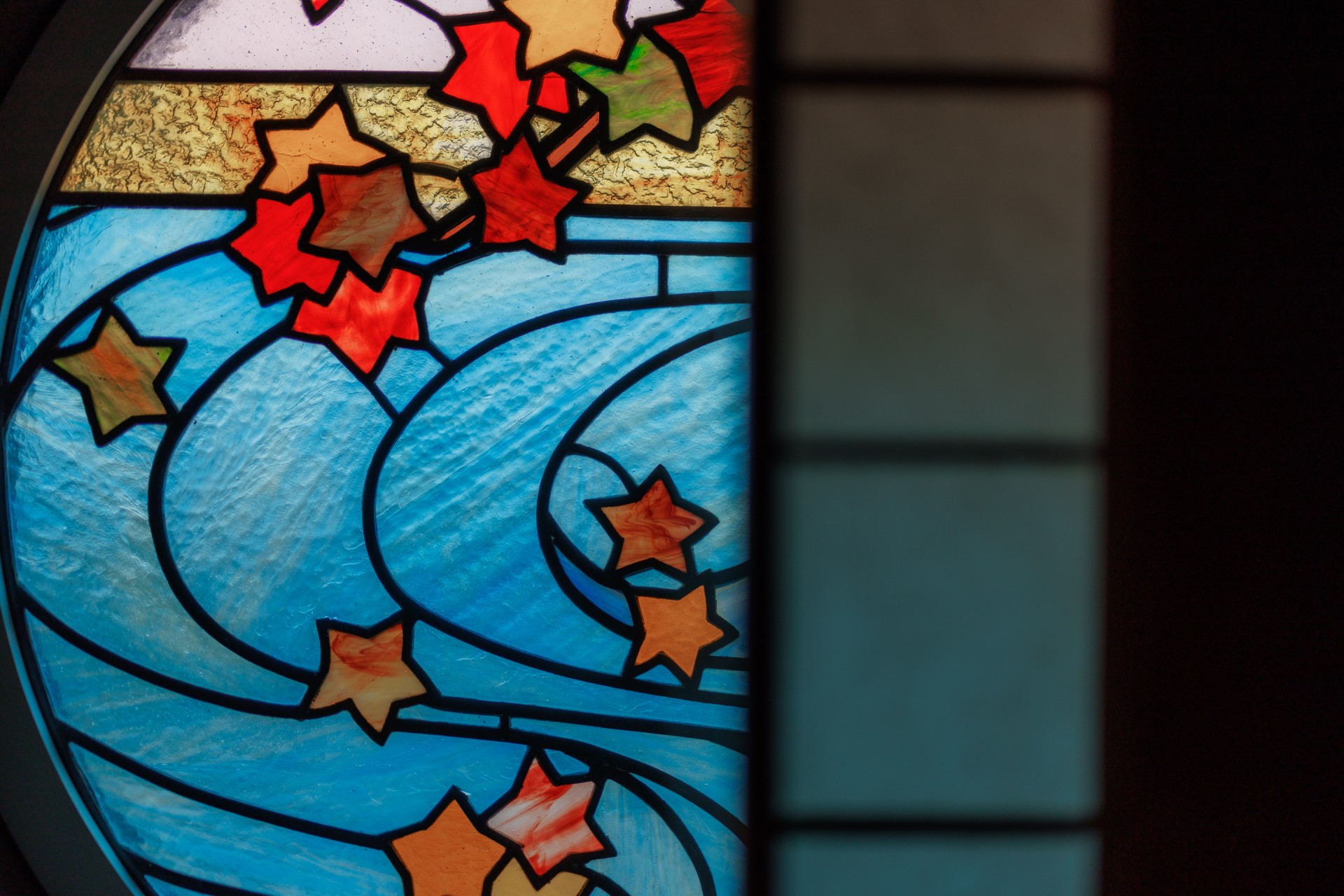 a stained glass window with stars