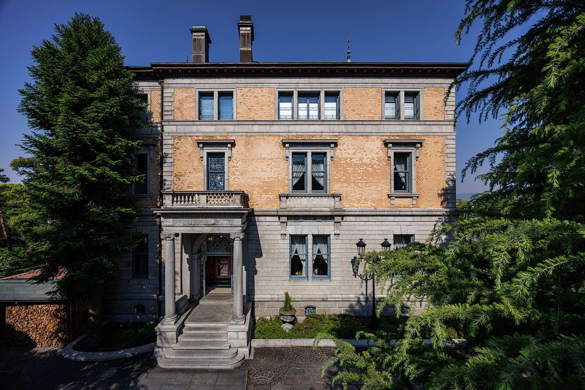 a building with a stone walkway and a stone walkway