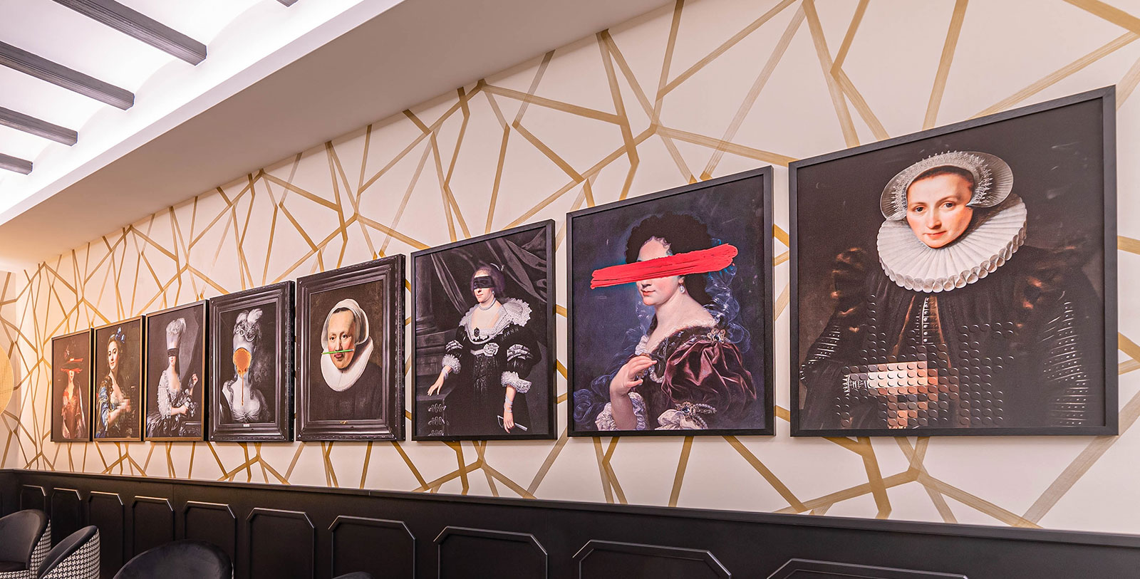a group of framed pictures on a wall