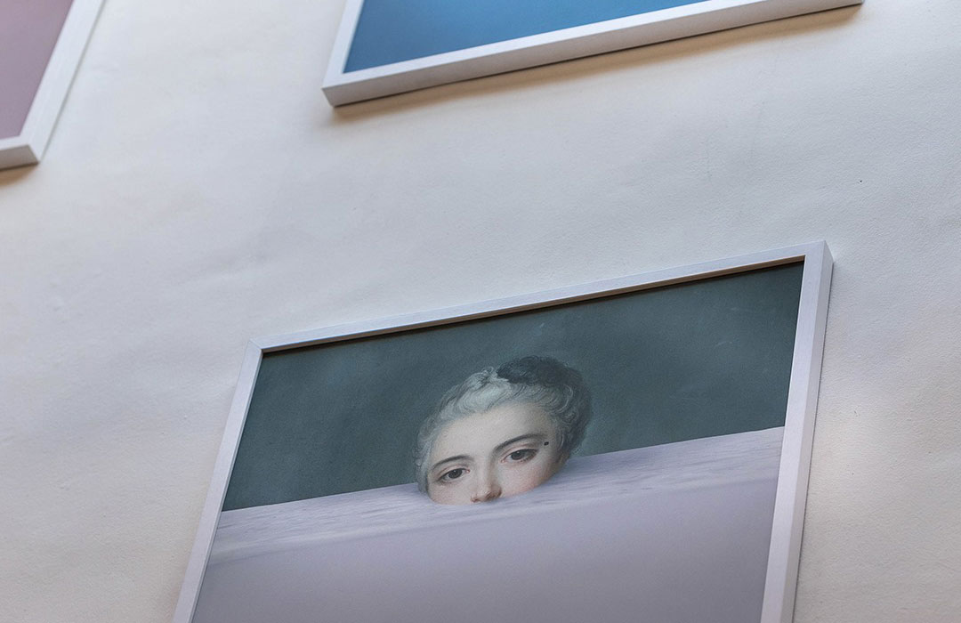 a framed picture of a woman's face