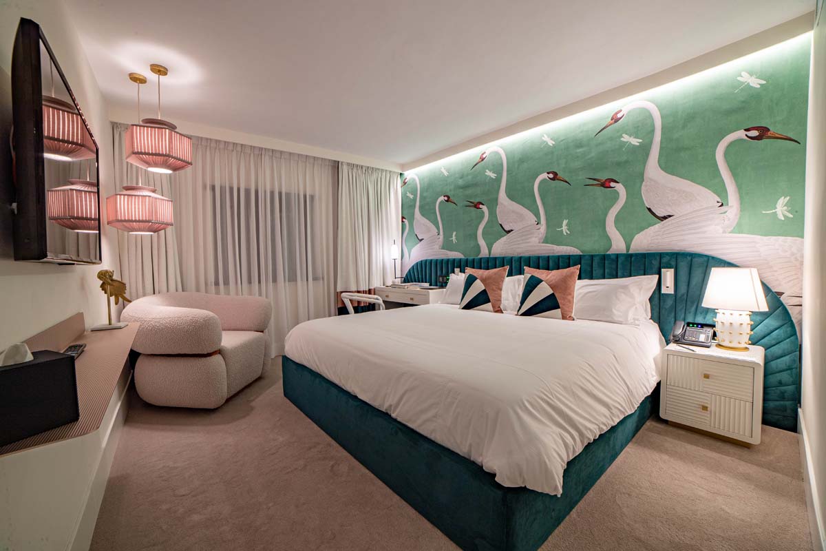 a bedroom with a bed and a chair