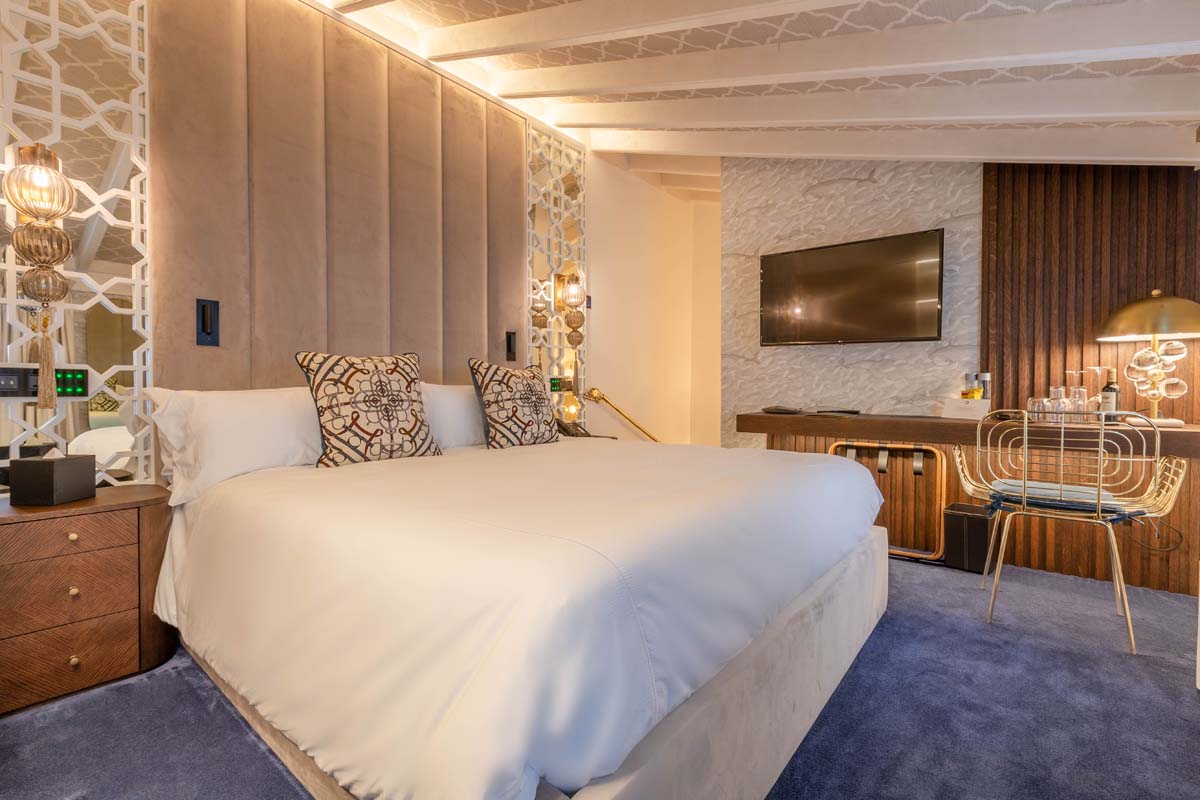 a room with a bed and a desk