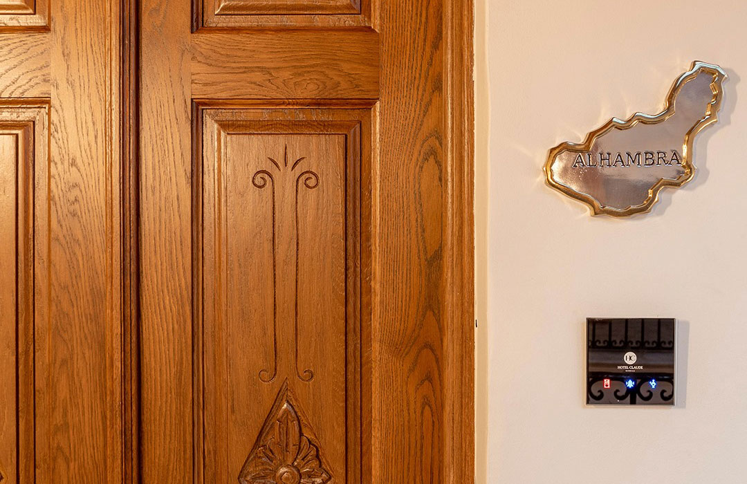 a wooden door with a sign on the wall