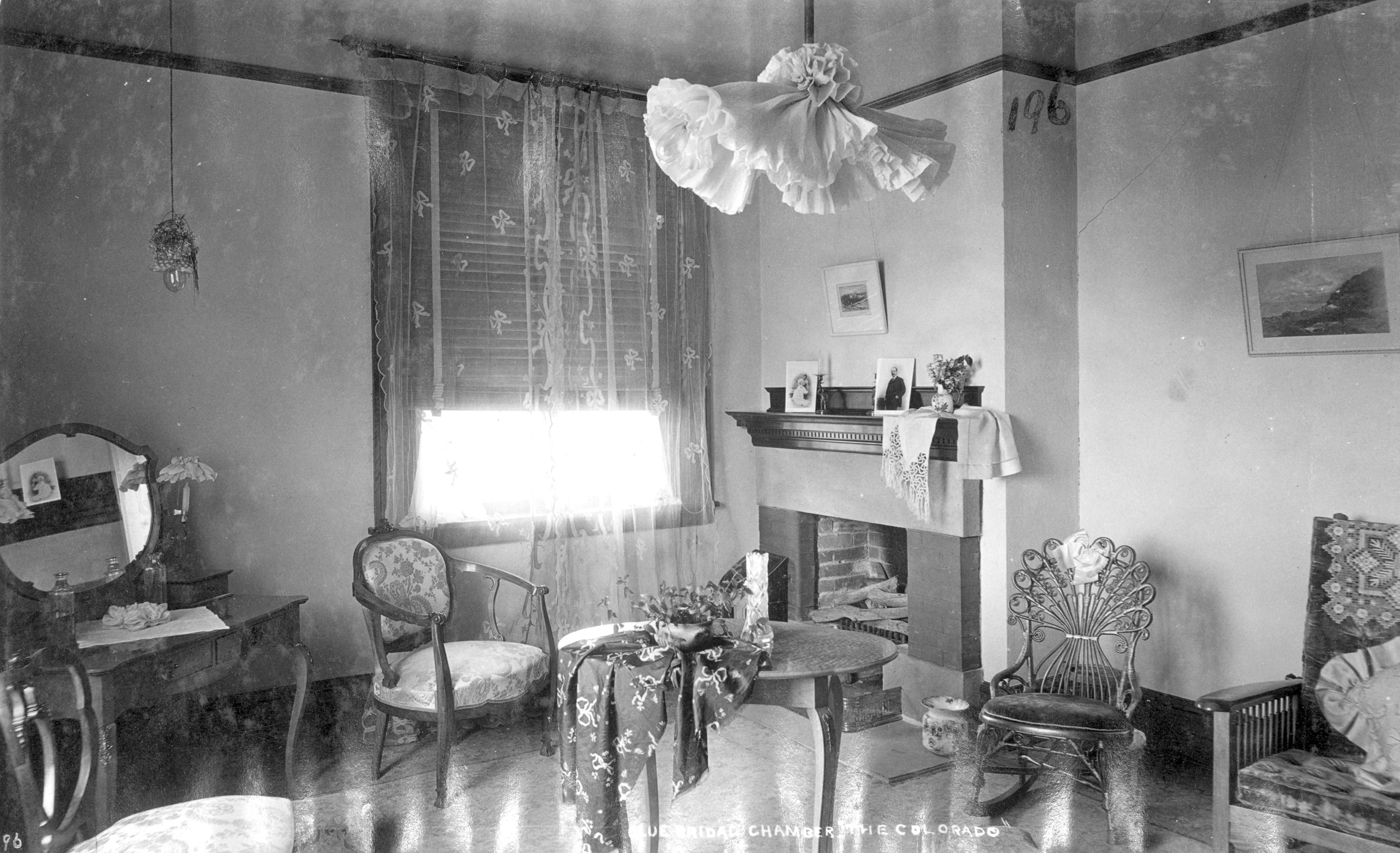 a room with a fireplace and chairs