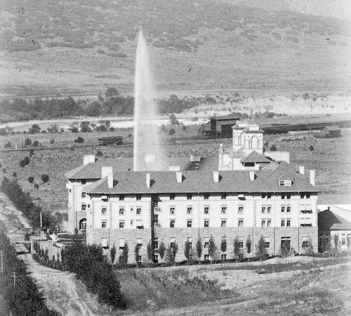a building with a water spouting