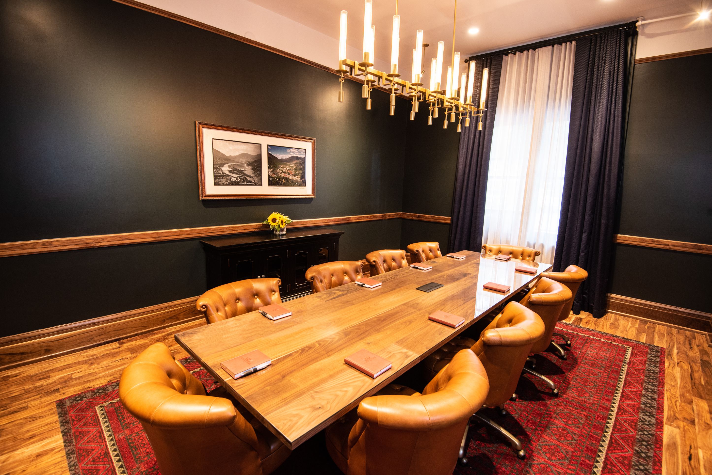 a conference room with a table and chairs