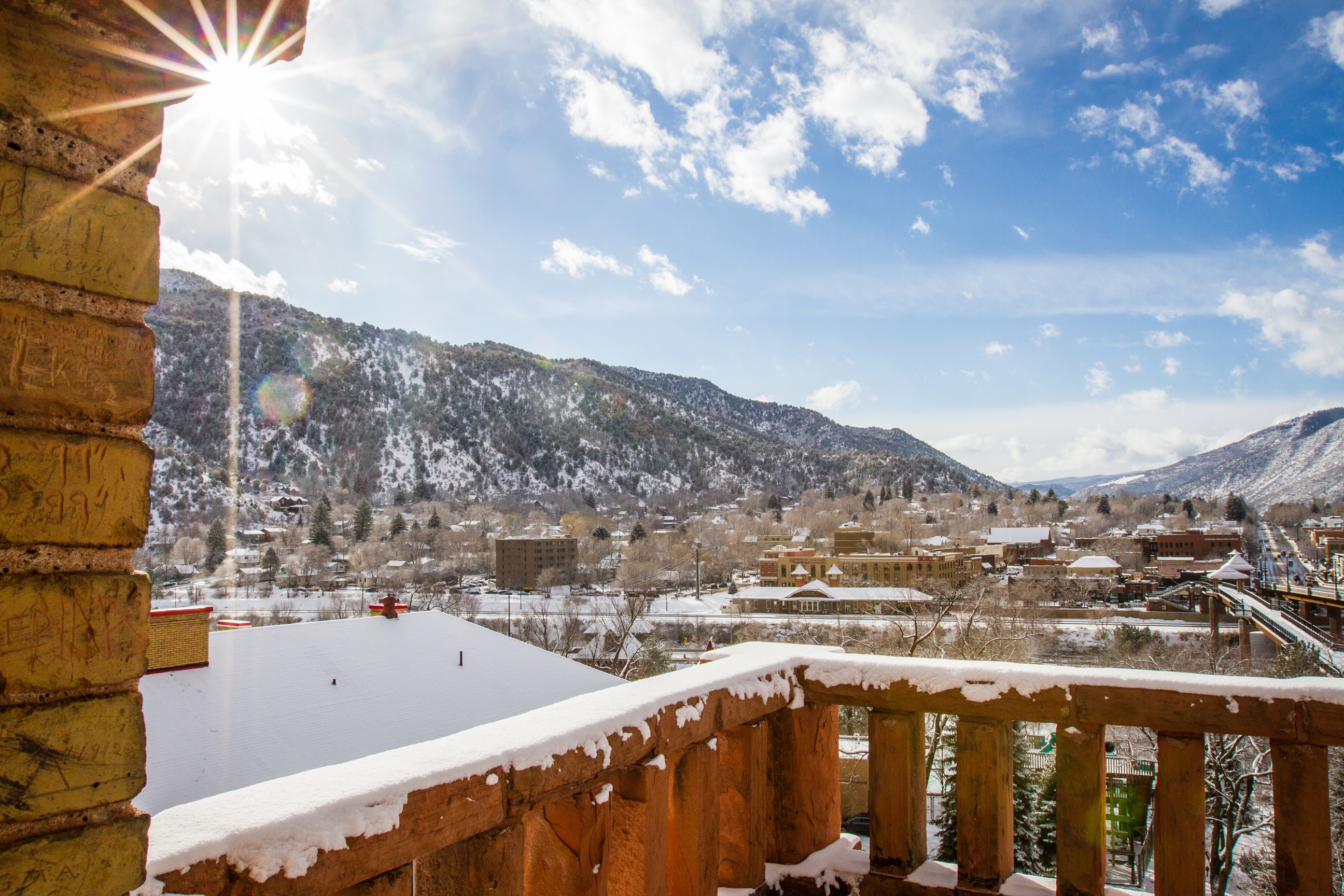 a snowy rooftop with a mountain in the background