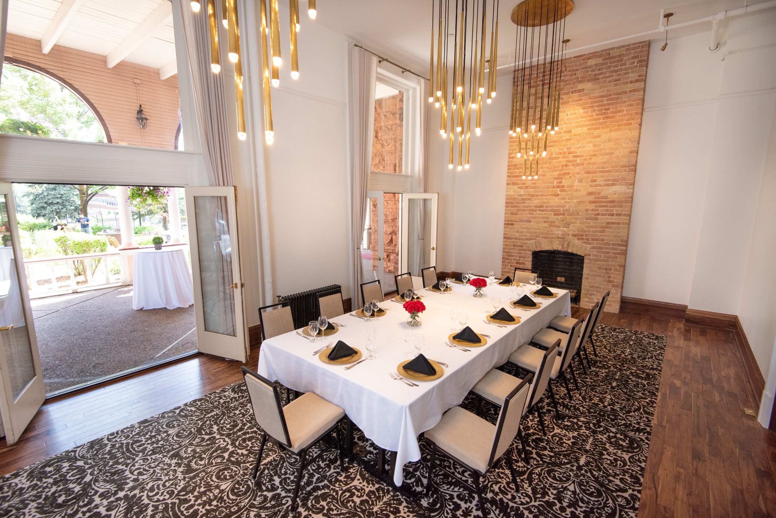 a dining table with chairs and a chandelier