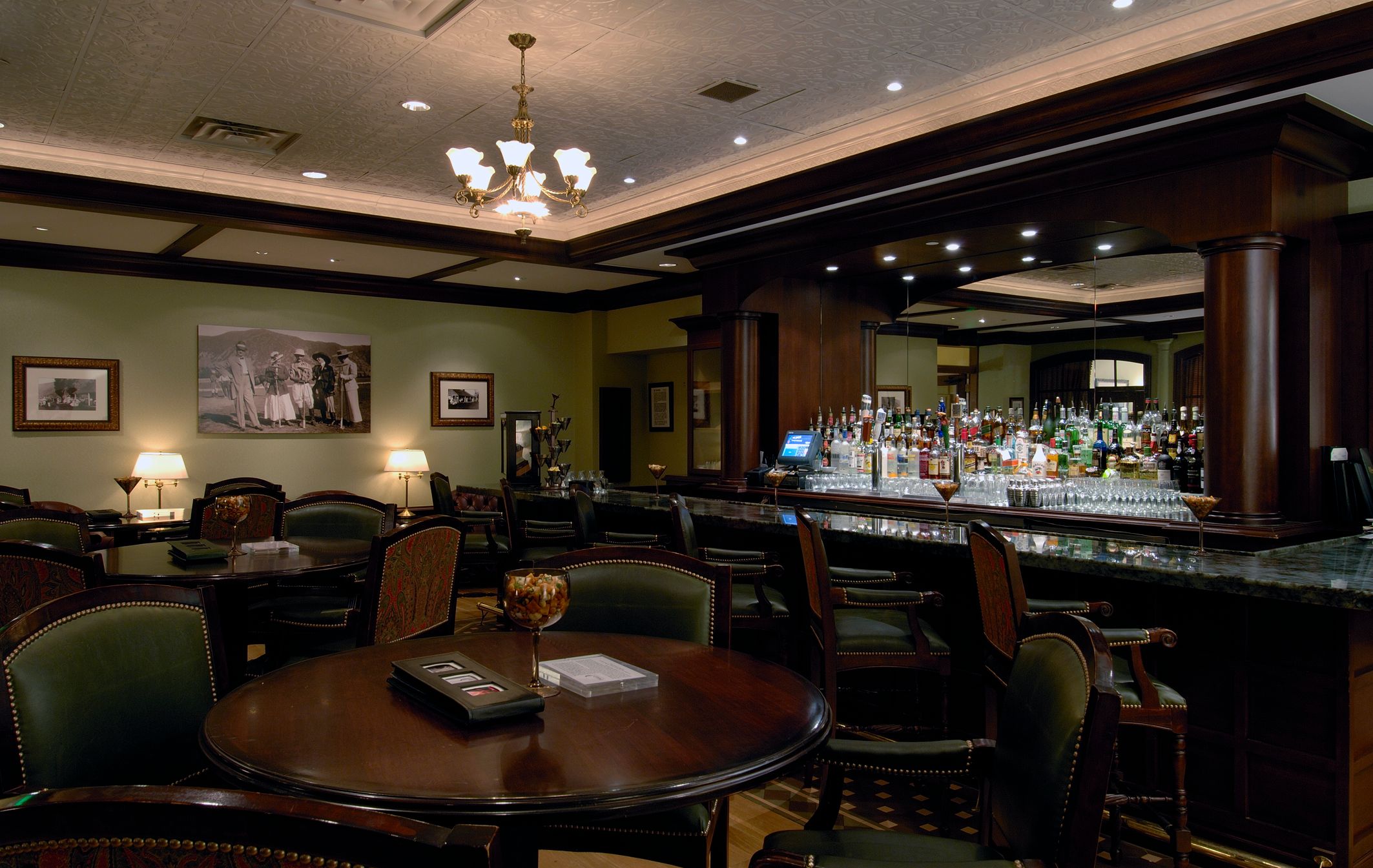 a bar with many tables and chairs