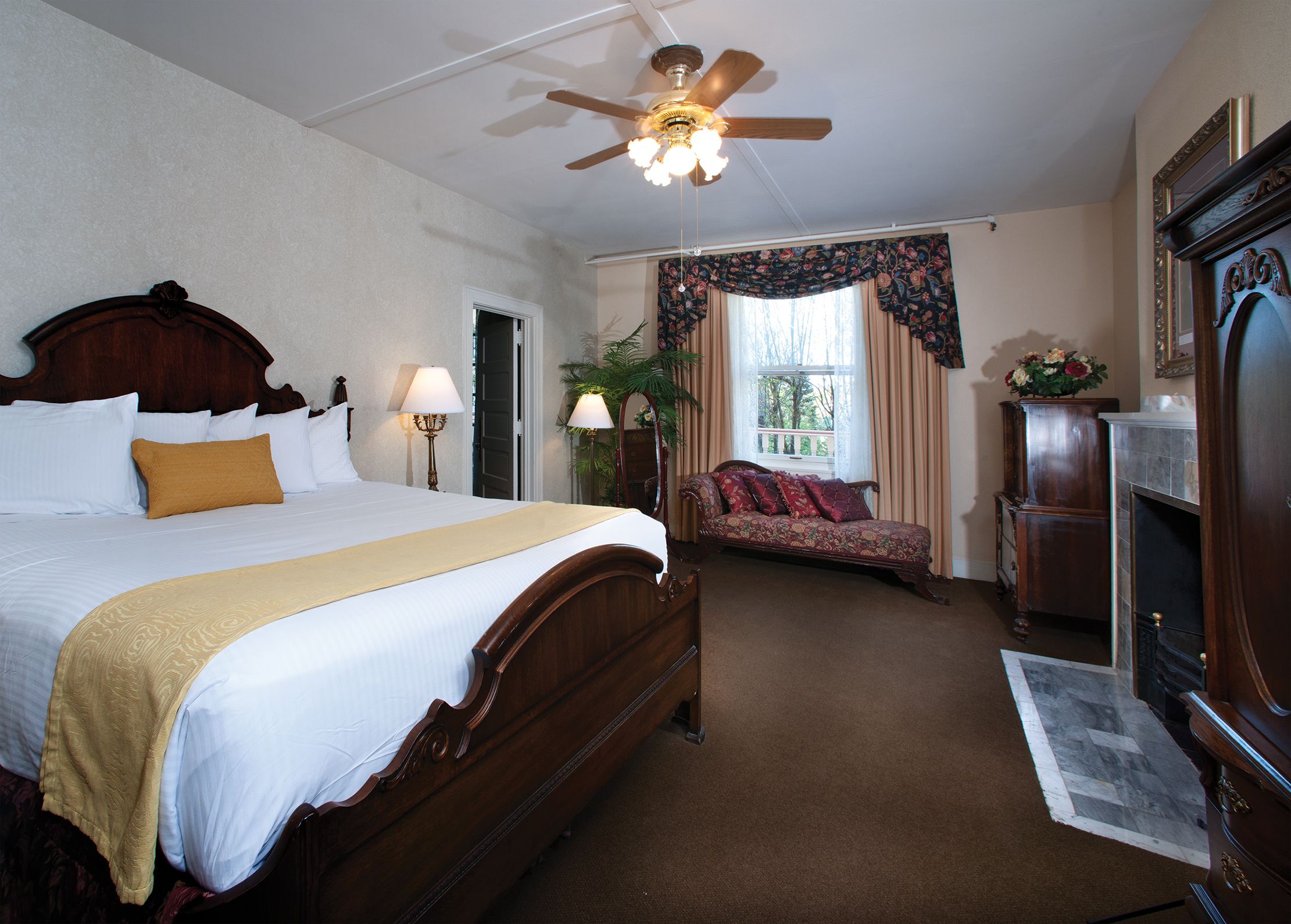 a bedroom with a bed and a couch