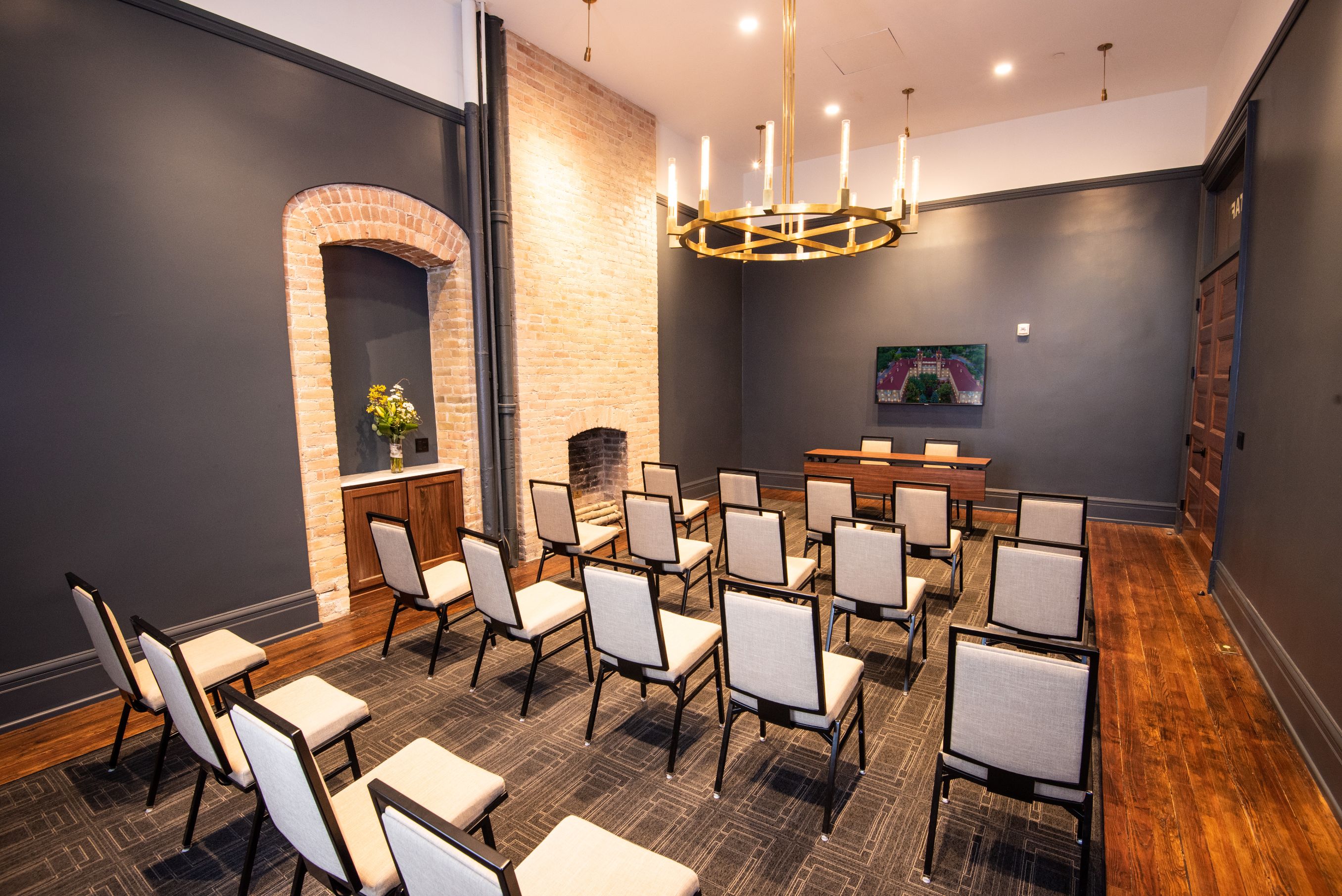 a room with chairs and a chandelier