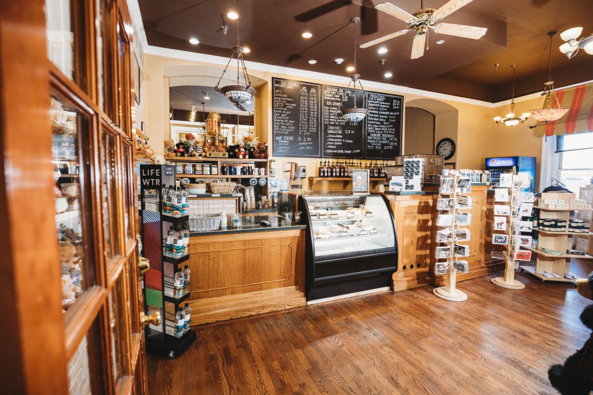 a coffee shop with a black board