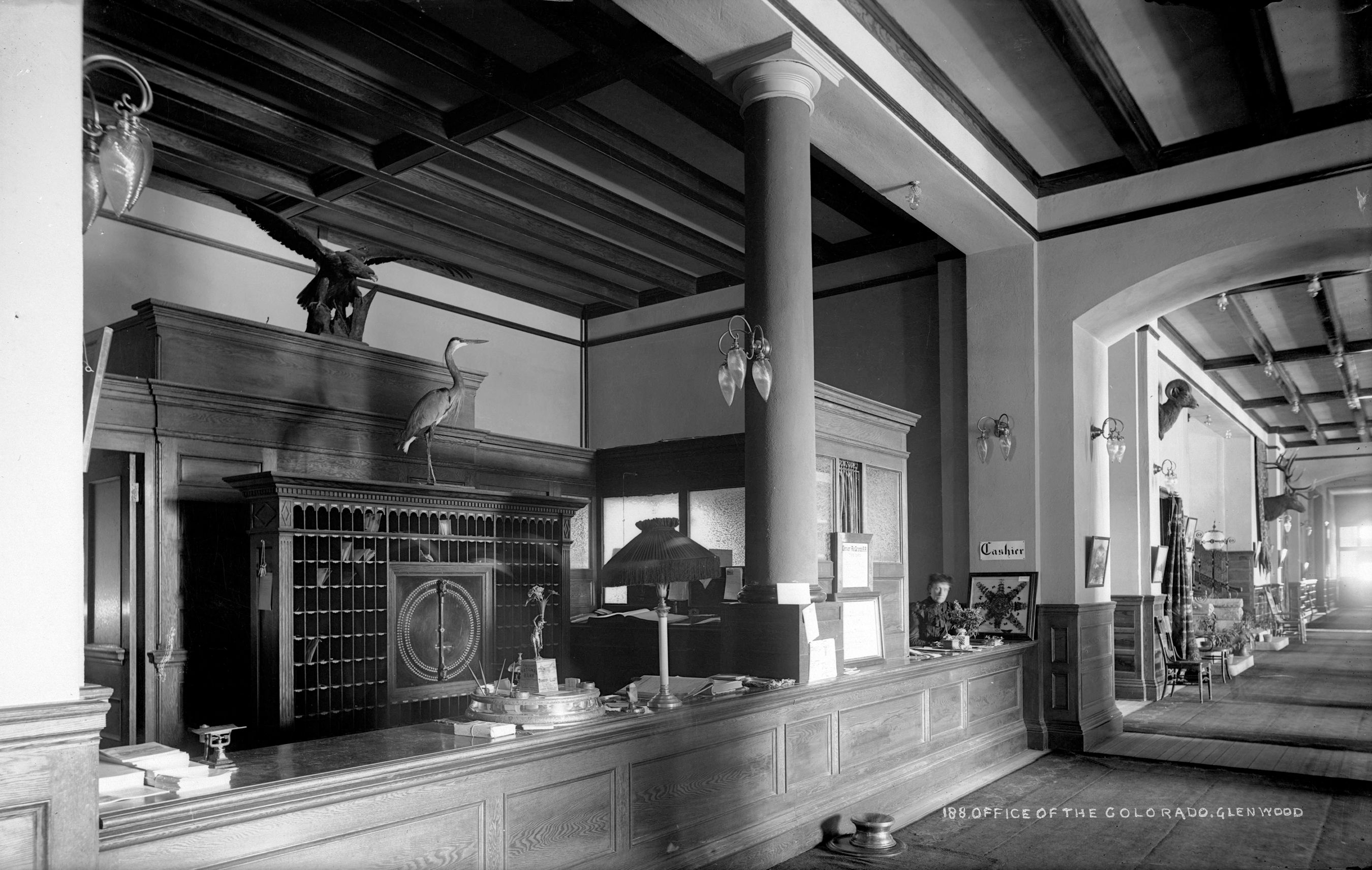 a black and white photo of a reception desk