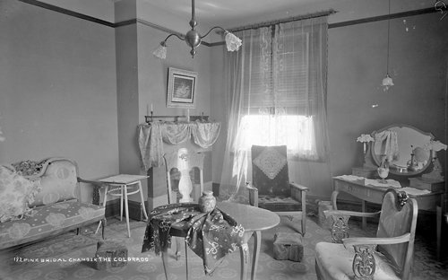 a room with a table and chairs