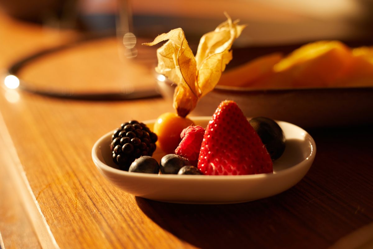 a bowl of fruit on a table