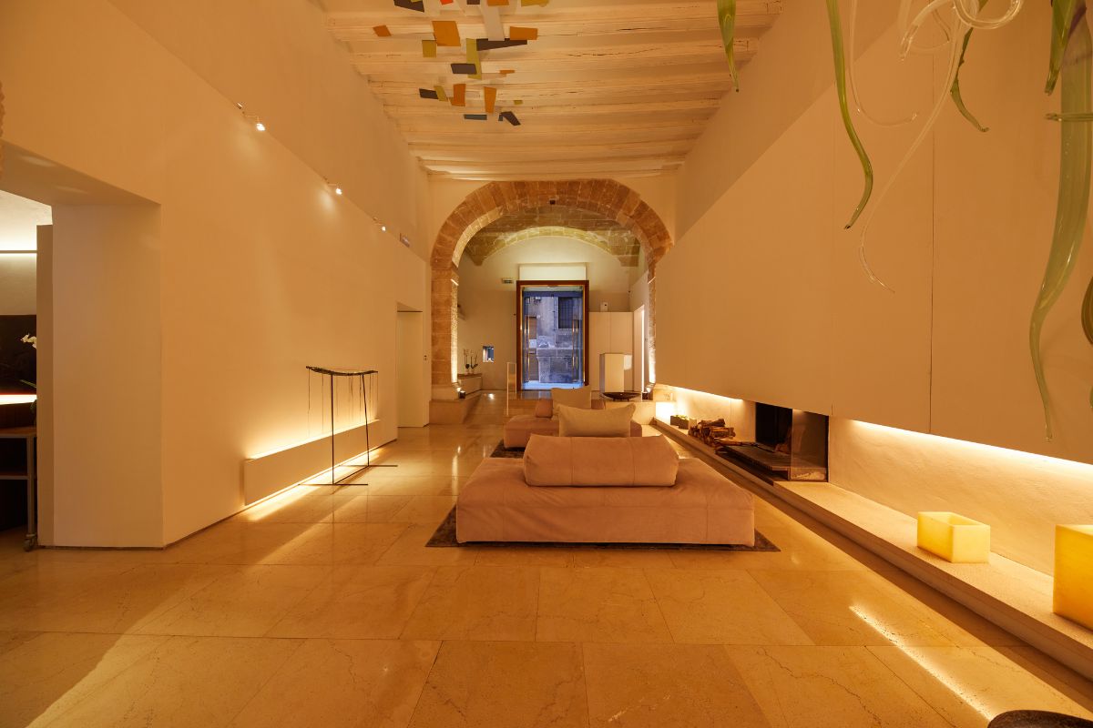 a room with a fireplace and couches