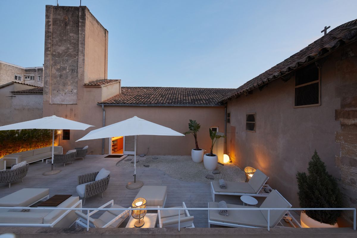 a patio with chairs and umbrellas