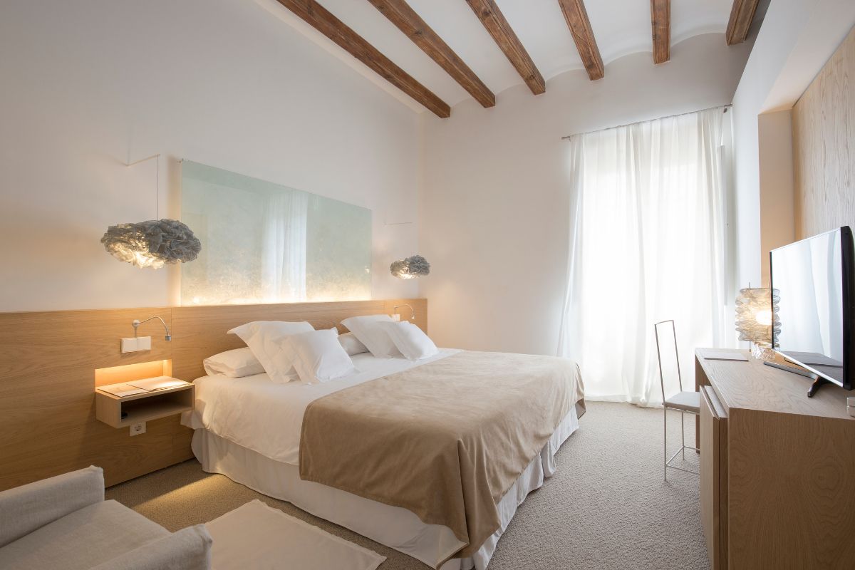 a bedroom with a bed and a desk