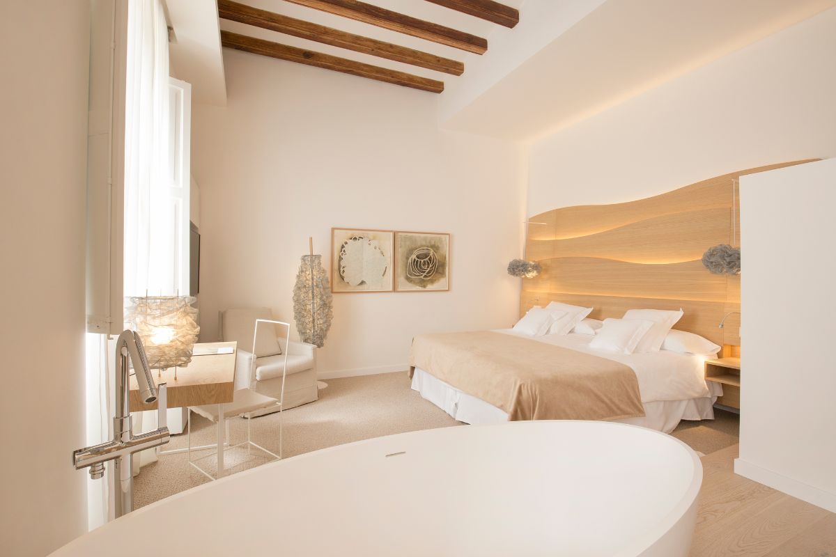 a bedroom with a bed and a desk