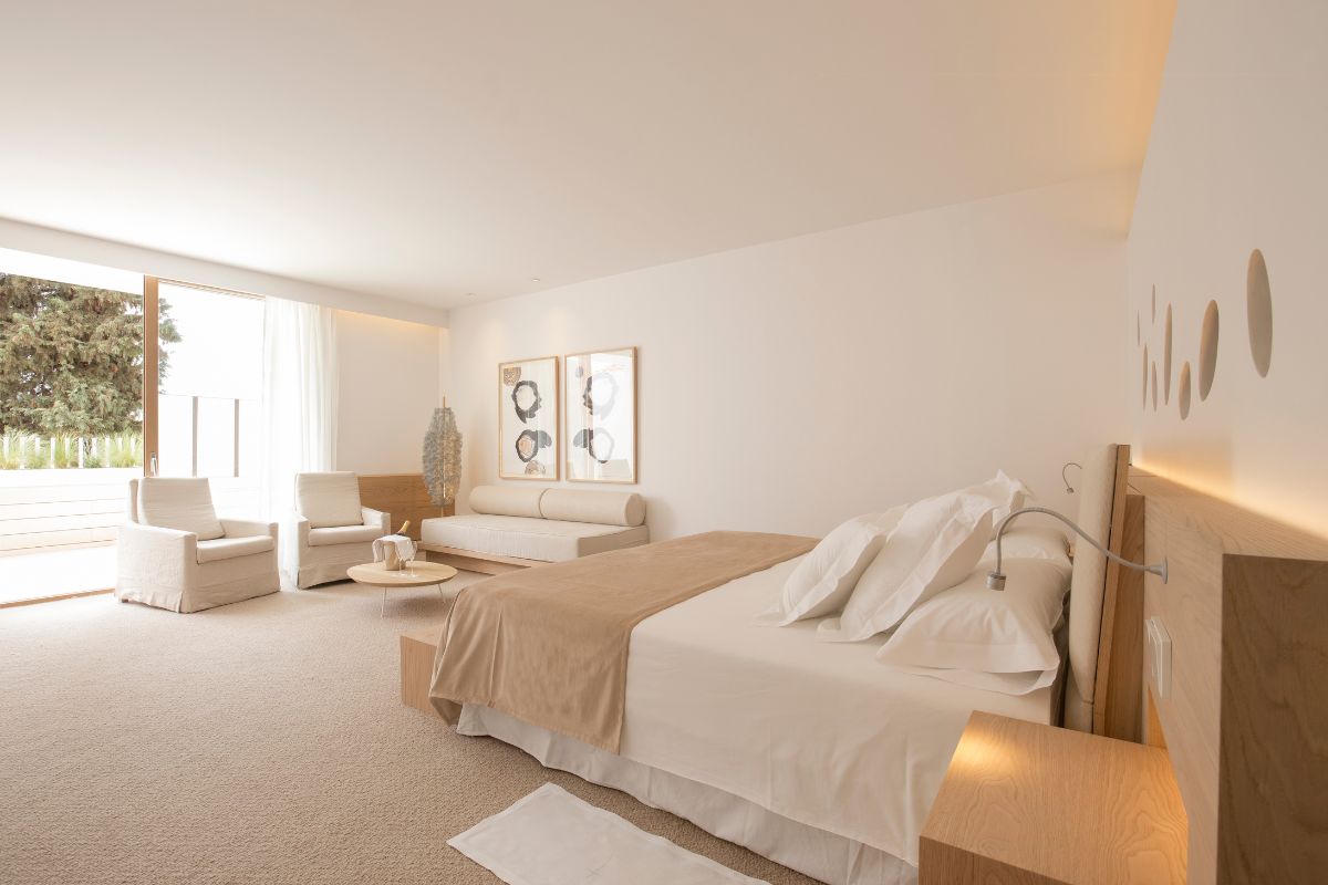 a bedroom with a bed and a couch