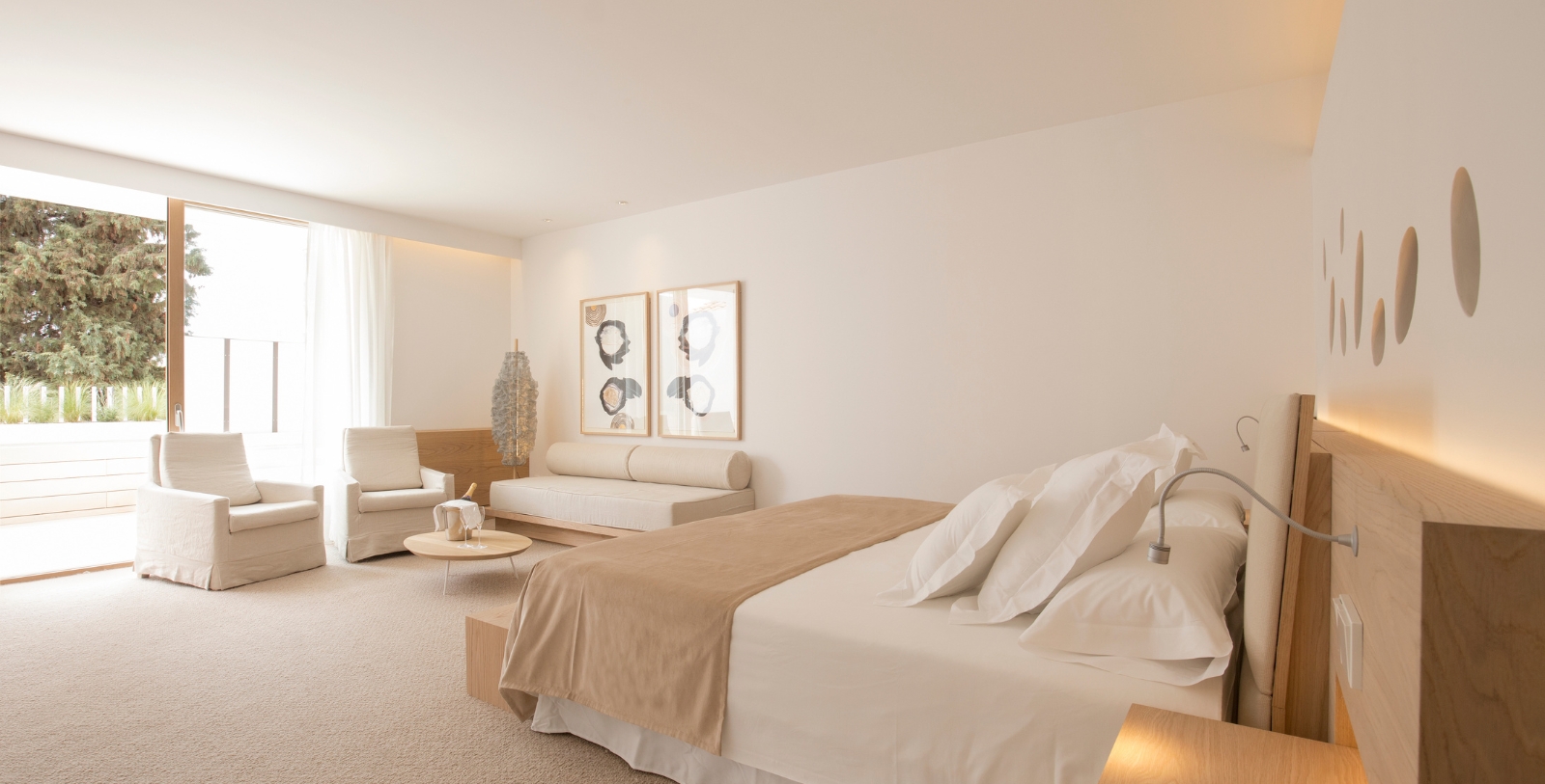 a bedroom with a bed and couches